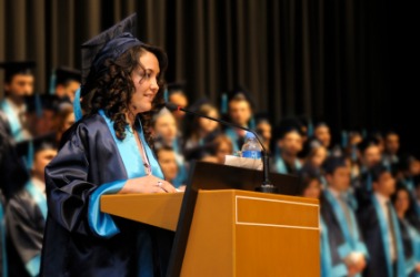 A graduate speaking at her commencement ceremony. A graduate speaking at her commencement ceremony.