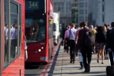 People taking the bus to commute to work. People taking the bus to commute to work.