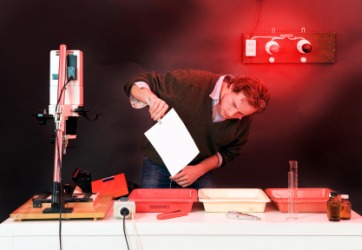 A photographer working in his darkroom. A photographer working in his darkroom.
