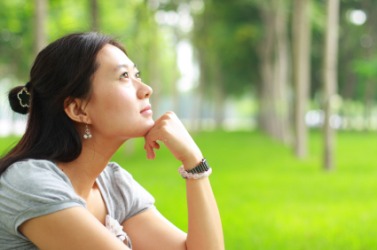 A young woman daydreaming. A young woman daydreaming.