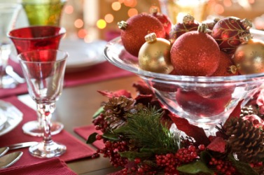 Holiday decorations brighten a table. Holiday decorations brighten a table.