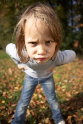 A child acting defiant. A child acting defiant.