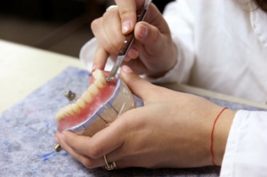 A set of dentures, or dental plate, being made. A set of dentures, or dental plate, being made.