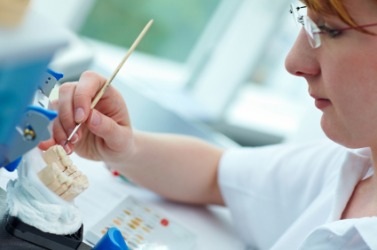 A dental technician at work. A dental technician at work.