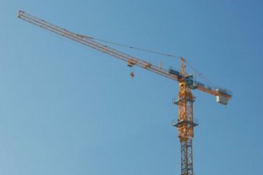 This large derrick is used in constructing tall buildings. This large derrick is used in constructing tall buildings.