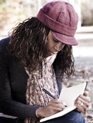 A woman writing in her diary. A woman writing in her diary.