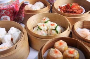 A variety of dim sum in bamboo containers. A variety of dim sum in bamboo containers.