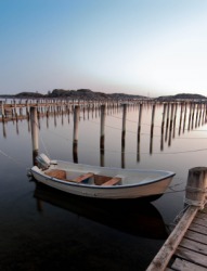 A dinghy tied at the dock. A dinghy tied at the dock.