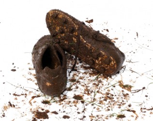 A pair of dirty shoes. A pair of dirty shoes.
