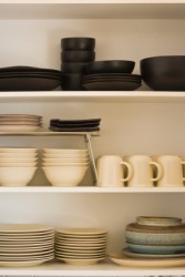 Shelves full of dishware. Shelves full of dishware.