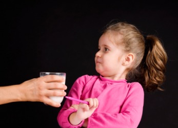 This girl dislikes milk. This girl dislikes milk.