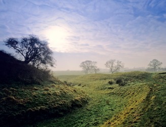 An irrigation ditch running through a field. An irrigation ditch running through a field.
