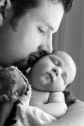 A baby with his doting father. A baby with his doting father.