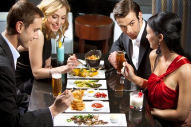 A double date at a restaurant. A double date at a restaurant.