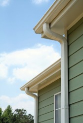 A downspout on a house. A downspout on a house.