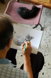 An archer draws back his bow string. An archer draws back his bow string.