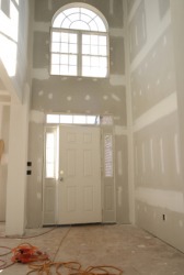 Dry wall installed in an unfinished house. Dry wall installed in an unfinished house.