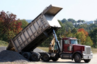 A dump truck at a construction site. A dump truck at a construction site.
