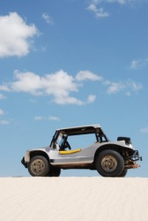 A dune buggy on the beach. A dune buggy on the beach.