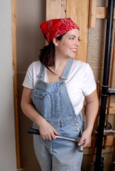 A woman wearing dungarees. A woman wearing dungarees.