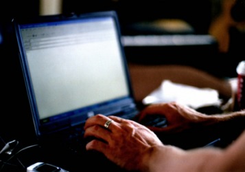 A person writing an e-mail. A person writing an e-mail.