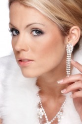 A woman wearing expensive earrings. A woman wearing expensive earrings.
