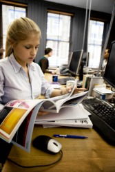 A junior editor at a magazine publishing office. A junior editor at a magazine publishing office.