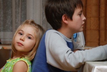 A little girl with her elder brother. A little girl with her elder brother.