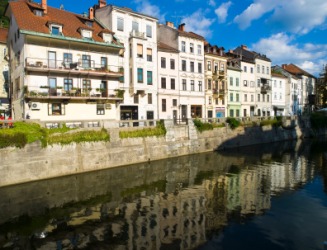 Picturesque buildings on a river embankment. Picturesque buildings on a river embankment.