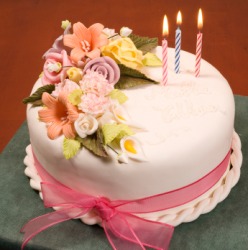 A cake embellished with flowers. A cake embellished with flowers.