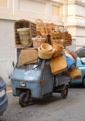 A motorcycle encumbered with baskets. A motorcycle encumbered with baskets.