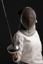 A fencer holds an epee. A fencer holds an epee.