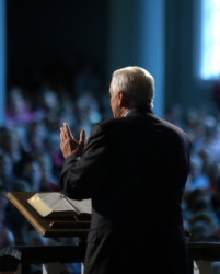 An evangelist speaks to his congregation. An evangelist speaks to his congregation.