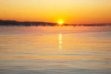 Evenings can sometimes be foggy over a lake. Evenings can sometimes be foggy over a lake.