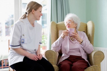 An elderly woman in an extended care facility. An elderly woman in an extended care facility.