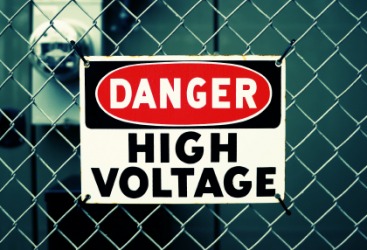 A sign warning of extra-high voltage. A sign warning of extra-high voltage.