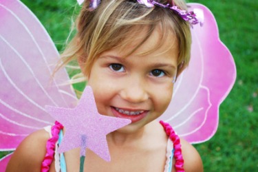 A little girl dressed as a fairy. A little girl dressed as a fairy.