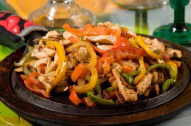 A platter of chicken fajitas. A platter of chicken fajitas.