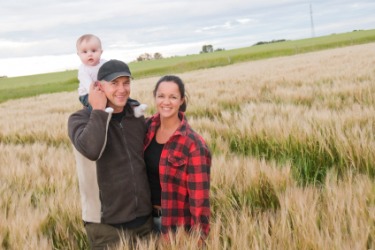 A farmwoman with her farmer husband. A farmwoman with her farmer husband.