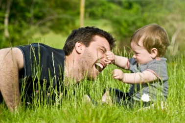 A father plays with his child. A father plays with his child.