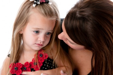 A woman comforts her child who is feeling sad. A woman comforts her child who is feeling sad.