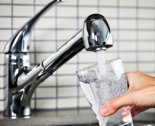 Someone fills a glass with water. Someone fills a glass with water.