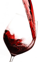 Filling a glass with wine. Filling a glass with wine.