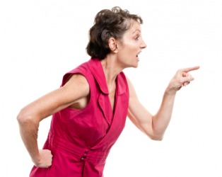A woman engaged in finger-pointing. A woman engaged in finger-pointing.