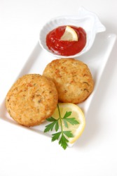 A plate of fish cakes. A plate of fish cakes.