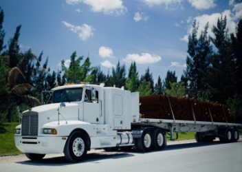 Materials being hauled on a flatbed truck. Materials being hauled on a flatbed truck.