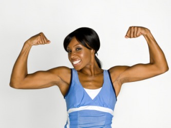 A woman flexes her muscles. A woman flexes her muscles.