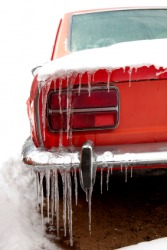Icicles hang from a car on a frigid day. Icicles hang from a car on a frigid day.