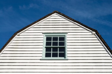 A gambrel roof on an old building. A gambrel roof on an old building.