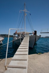 A gangplank to a fishing boat. A gangplank to a fishing boat.